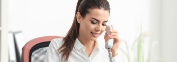 Dental reception assistant calling to client